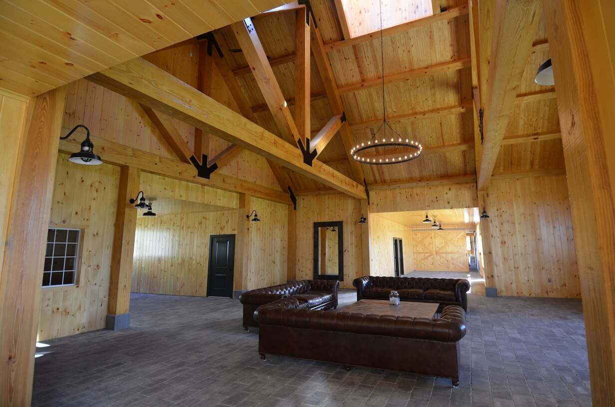 Custom Stables - Vaulted Ceiling frames a custom seating area within a stable