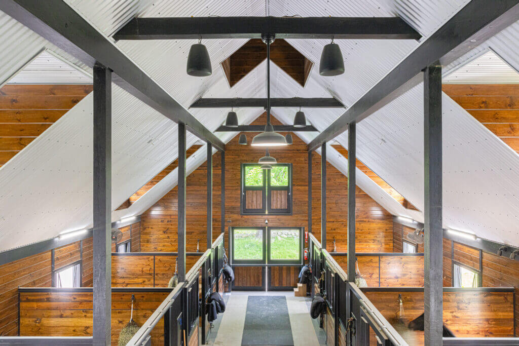 A Custom Horse Barn Interior designed by Old Town Barns