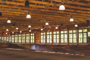 Well lit rustic indoor riding arena