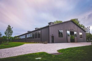 Indoor Riding Arena to match Horse Barn, both designed by Old Town Barns